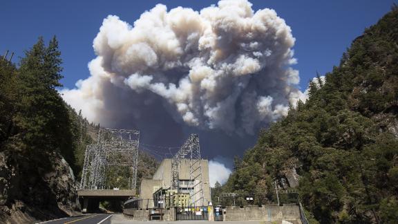 Heavy plumes of smoke billow from the Dixie fire above the Plumas National Forest near the PG&E Rock Creek Power House on July 21.