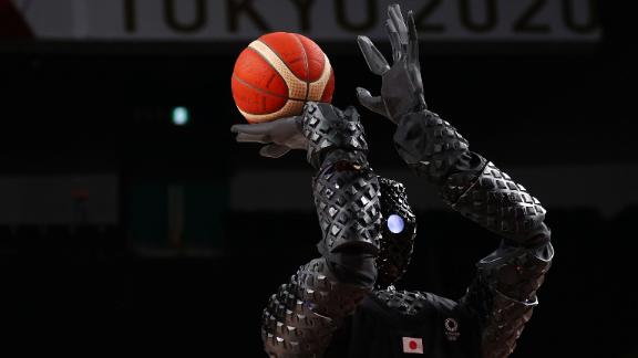 A robot shoots a free throw during halftime of a women's basketball game between Belgium and Puerto Rico on July 30. 