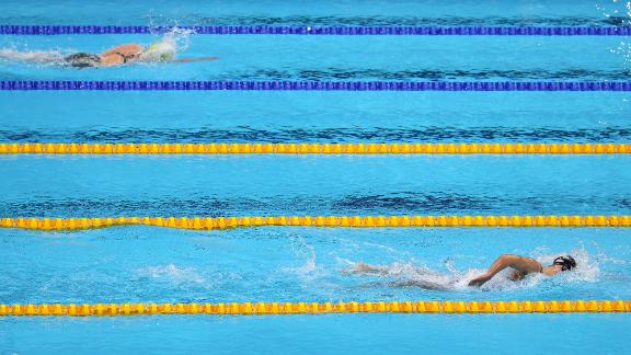 The United States' Katie Ledecky leads Australia's Ariarne Titmus during the 800-meter freestyle on July 31. <a href=