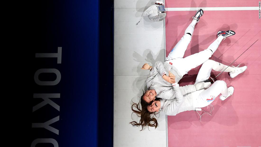 Russian fencers celebrate after winning gold in the team sabre event on July 31.