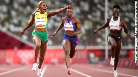 Elaine Thompson-Herah celebrates as she wins 100m gold at the Tokyo Olympics. 