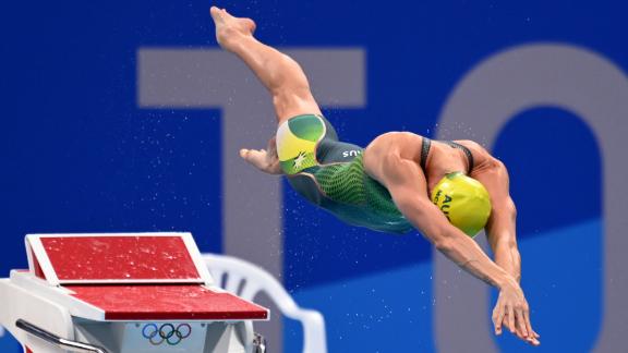 Australian swimmer Emma McKeon dives into the pool at the start of the 50-meter freestyle final on August 1. <a href=