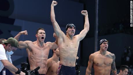 Ryan Murphy (from left), Zach Apple and Caeleb Dressel of Team United States react after winning the gold medal and breaking the world record in the Men&#39;s 4x100m Medley Relay Final on Sunday.