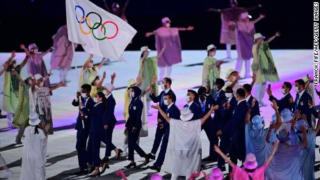 The Refugee Olympic Team&#39;s delegation parades during the Opening Ceremony of the Tokyo Olympics.