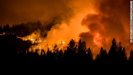 The Dixie Fire burns through the night illuminating the smoke on July 31, 2021.
