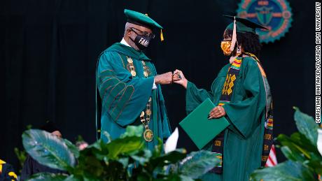 FAMU President Larry Robinson greets a 2020 graduate during the July 31 ceremony.