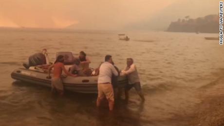 Hundreds flee popular tourist resort by boat as wildfires blaze in Turkey