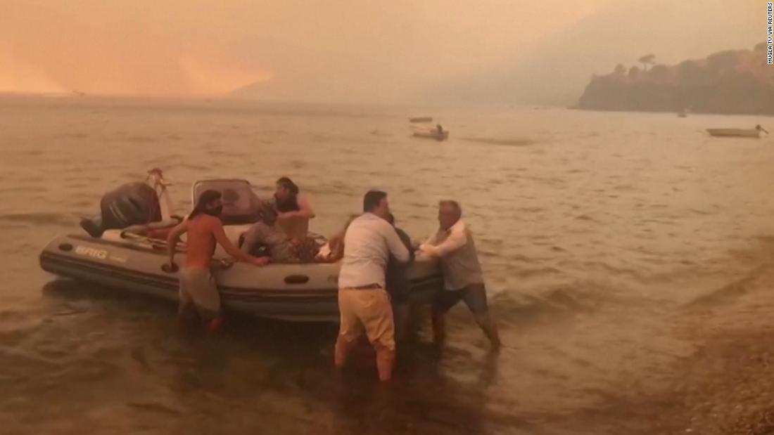 Hundreds Flee Popular Tourist Resort By Boat As Wildfires Blaze In