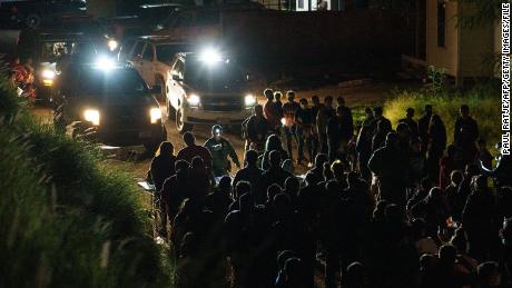 US Border Patrol agents process migrants who crossed the Mexico border into the United States in Roma, Texas, on July 9, 2021.