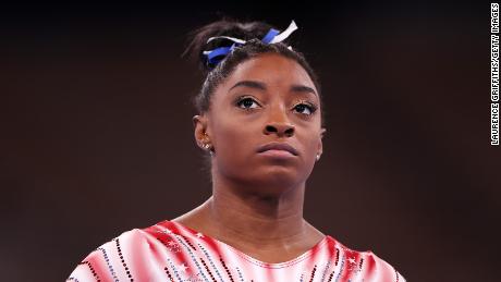 Biles looks on during warm-ups prior to the women&#39;s balance beam final.