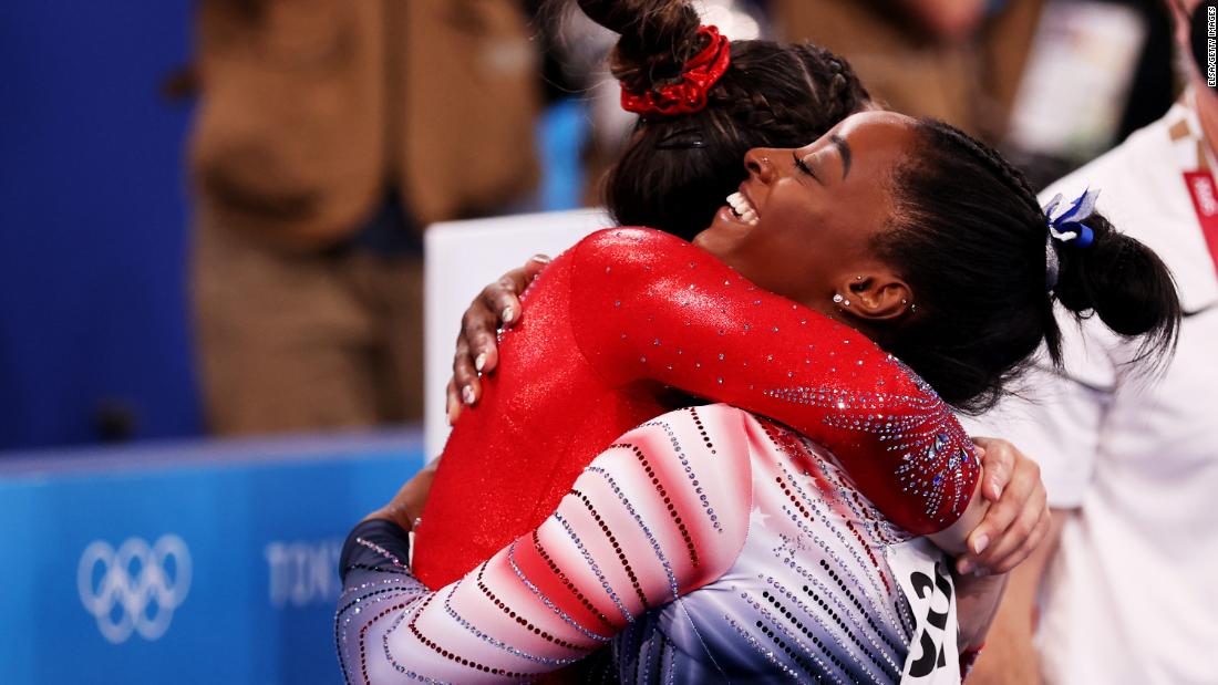 Biles is hugged by teammate Suni Lee, who was also competing in the event. Lee &lt;a href=&quot;http://www.cnn.com/2021/07/29/sport/gallery/suni-lee-gymnastics-gold-olympics/index.html&quot; target=&quot;_blank&quot;&gt;won the individual all-around&lt;/a&gt; last week.
