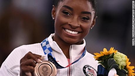 Simone Biles won a bronze medal in the women&#39;s balance beam competition on Tuesday.