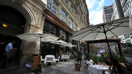 Diners are seated in the outdoor dining area of Gramercy Tavern, where owner Danny Meyer announced a vaccine mandate for all his restaurants, employees and diners will need to show proof of vaccination, New York, NY, July 30, 2021. 