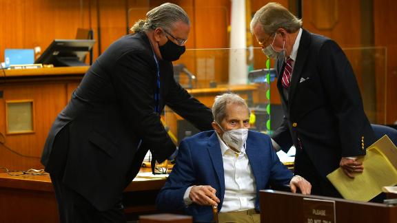 Defense attorneys Dick DeGuerin, right, and David Z. Chesnoff adjust Robert Durst's wheelchair as attorneys begin opening statements in his murder trial at Inglewood Courthouse on May 18, 2021.