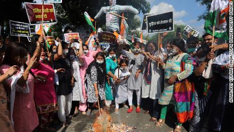 Protesters burn an effigy of Indian Prime Minister Narendra Modi and Delhi Chief Minister Arvind Kejriwal during a demonstration in Delhi on August 3.