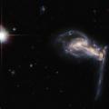 hubble spots squabbling galactic siblings