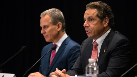 New York Gov. Andrew Cuomo issues an executive order putting state Attorney General Eric Schneiderman (n charge of investigating allegations of police abuse at John Jay College on July 8, 2015, in New York City. 