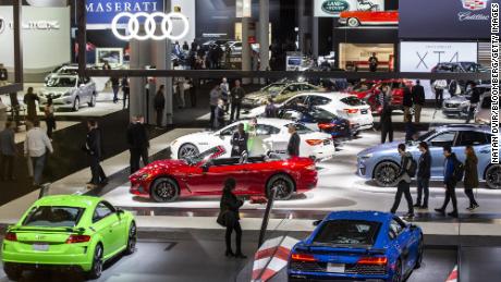 Attendees walk through the exhibition floor of the 2019 New York International Auto Show.