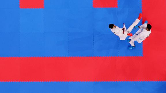 Turkey's Eray Samdan, left, takes on Azerbaijan's Firdovsi Farzaliyev as karate made its Olympic debut on August 5. Samdan won 7-1 and went on to earn a silver medal.
