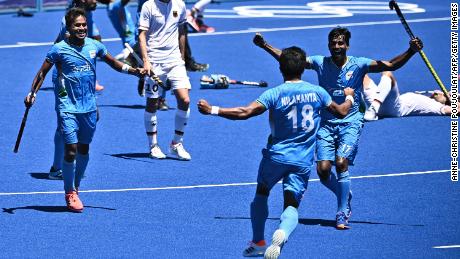 Players of India celebrate after winning the men&#39;s bronze medal match.