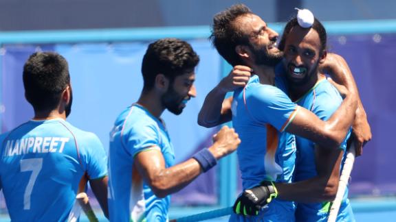 Harmanpreet Singh celebrates his third goal with his teammates in the men's bronze medal game. 