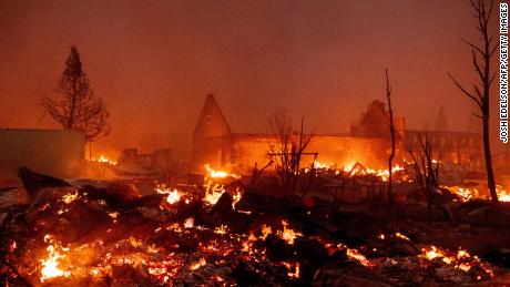 Buildings burn as the Dixie fire tears through downtown Greenville, California.