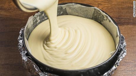 The CDC warns people not to eat raw cake batter because it can contain harmful bacteria that are only killed during cooking.