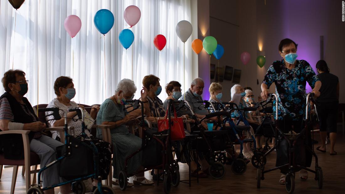 Elderly Israelis wait to receive their third shot of the Pfizer vaccine at a nursing home in Netanya on Sunday.