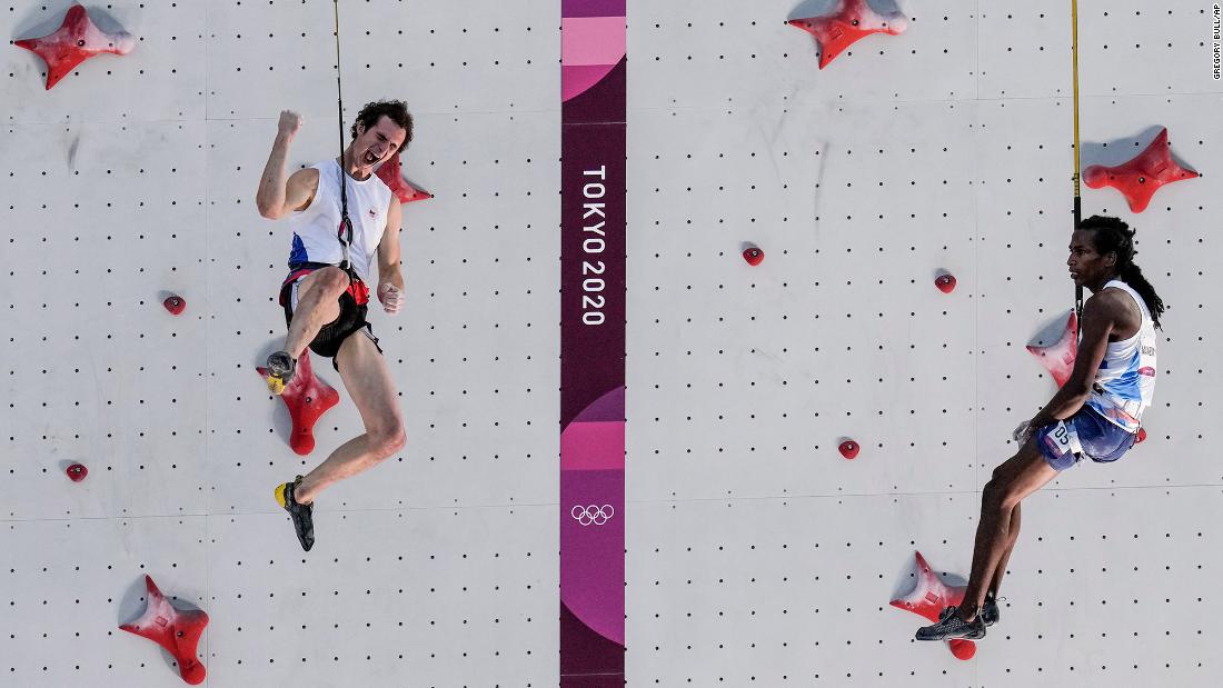 The Czech Republic&#39;s Adam Ondra, left, celebrates after he defeated France&#39;s Mickael Mawem in the sport climbing speed finals on August 5.