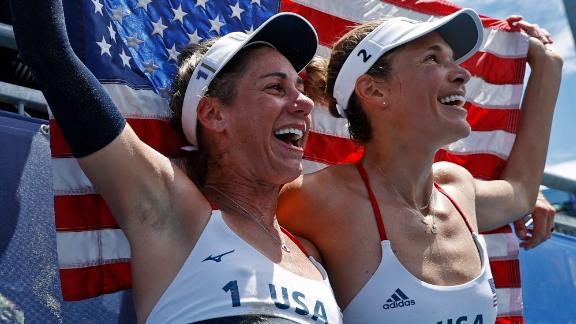 From left, American beach volleyball players April Ross and Alix Klineman celebrate after they won their <a href=