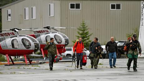 Ketchikan Volunteer Rescue Squad personnel land and disembark from a Hughes 369D helicopter on Thursday, Aug. 5, 2021, at Temsco Helicopters Inc in Ketchikan, Alaska.