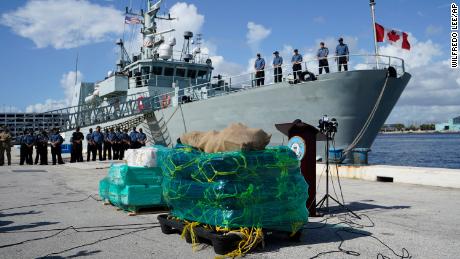 Crew members from the HMCS Shawinigan, of Canada, stand before a joint news conference with the US Coast Guard, Thursday at Port Everglades in Fort Lauderdale, Florida.
