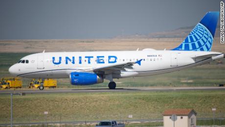 In this July 2, 2021 file photo, a United Airlines jetliner taxis down a runway for take off from Denver International Airport in Denver.  United Airlines will require U.S.-based employees to be vaccinated against COVID-19 by late October, and maybe sooner. United announced the decision Friday, Aug. 6. 