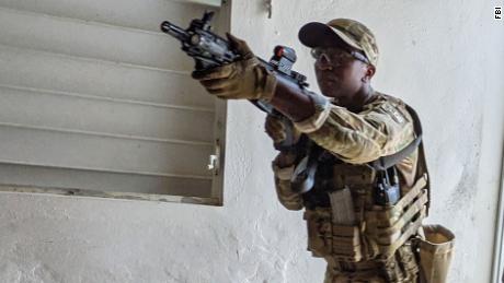 SWAT selectee Tai enters a room during close-quarters battle training at SWAT New Operator Training School in San Juan in May 2021.