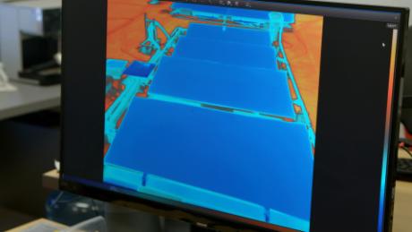 Infrared imaging shows the relatively lower temperature of the panels compared to their surroundings.