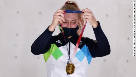 Garnbret poses with her gold medal at the Tokyo Olympics. 