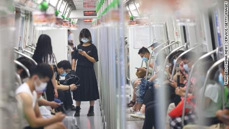 People wear face masks on the subway amid the Delta variant outbreak on July 27 in Nanjing, Jiangsu Province of China. 