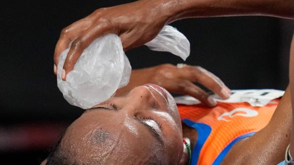 The Netherlands' Sifan Hassan places a bag of ice on her face after <a href=