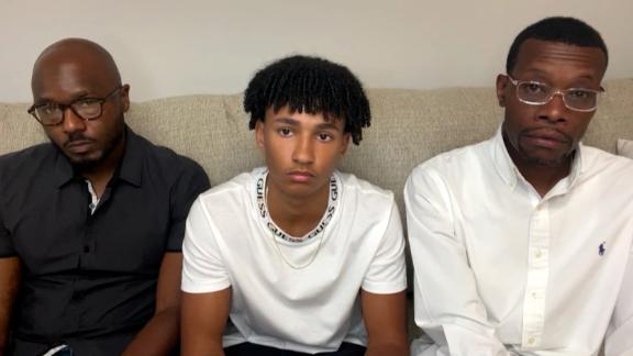 Roy Thorne, left, is seen with his 15-year-old son Samuel, middle, and realtor Eric Brown. All three were handcuffed by Wyoming, Michigan, police officers while touring a home.