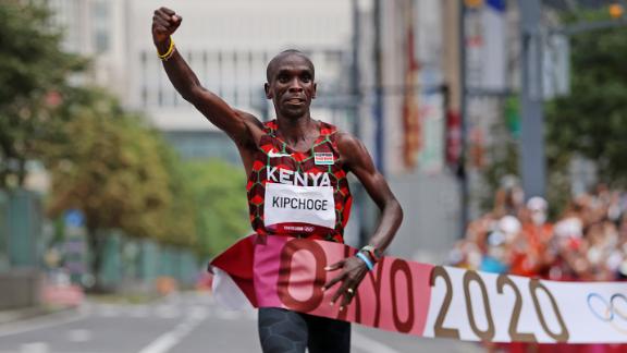 Kenya's Eliud Kipchoge crosses the finish line August 8 <a href=