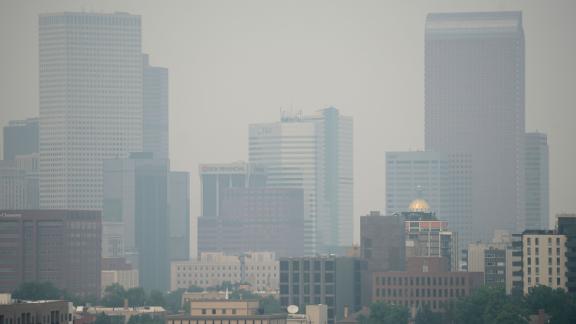 Smoke from western wildfires obscures the skyline of Denver on August 7, 2021.