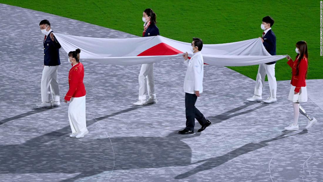 The Japanese flag is brought into the stadium at the start of the closing ceremony.