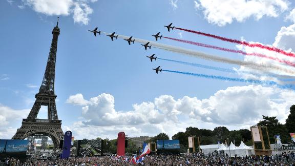 Jets conduct a flyover next to the Eiffel Tower in Paris. While the closing ceremony was held in Tokyo, a celebration was held in Paris. The French capital will be hosting the next Summer Games in 2024.