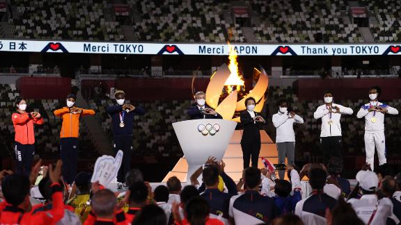 Thomas Bach, the president of the International Olympic Committee, makes a heart gesture as he delivers a speech at the closing ceremony. In his speech, Bach thanked the athletes and the Japanese people for their hard work and sacrifices in staging the most logistically challenging Olympic Games in history. 
