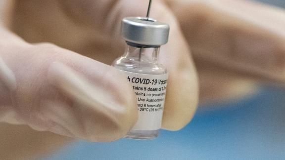 A healthcare worker prepares COVID-19 vaccine doses at the Portland Veterans Affairs Medical Center on December 16, 2020 in Portland, Oregon. The first rounds of Pfizer's vaccine were administered in Oregon on Wednesday.