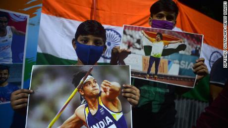 Supporters of India&#39;s athlete Neeraj Chopra celebrate after he won the gold medal in the men&#39;s javelin throw during the Tokyo 2020 Olympic Games.