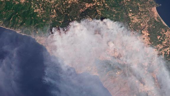 A satellite photo shows smoke rising from fires on the island of Evia, Greece, on Thursday, August 5.