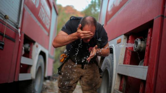A firefighter washes his face in the Milas area of Mugla, Turkey, on August 7.
