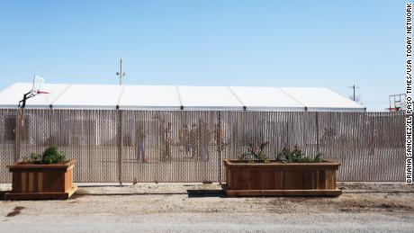 Migrant children play outside at a shelter for unaccompanied minors Friday, April 9, 2021, in Pecos. 