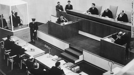 Adolf Eichmann listens in the prisoner&#39;s dock at the left, as presiding Judge Moishe Landau gives the verdict at the conclusion of his trial. 